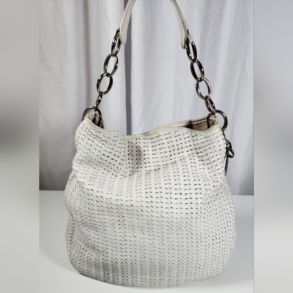 Christian Dior shoulder hobo. Ext shows signs of wear. Suede int nds cleaning